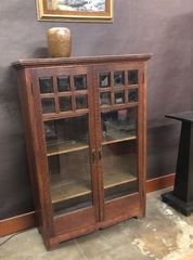Vintage Mission Oak Bookcase with beveled windows, shaped skirt & unique hardware.
